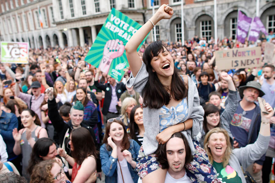 Photograph of Irish citizens celebrating on May 26th, 2018, after passage of a referendum to repeal a broad abortion ban enshrined in the country’s Constitution. Democratic deliberation played a key part in the genesis of the referendum to overturn this constitutional rule. The Irish Parliament went on to legalize abortion during the first 12 weeks of pregnancy, and later if the mother’s health is at risk.
