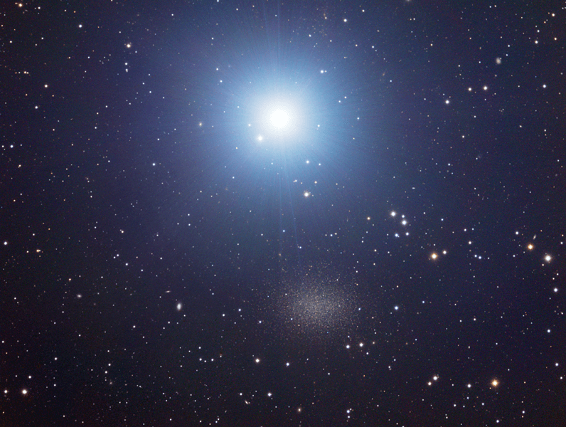 Photo shows a telescopic view of the very bright star Regulus and a much fainter collection of stars, the dwarf spheroidal galaxy Leo I.