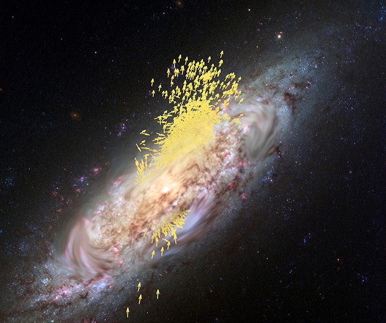 Image shows the swirl of a spiral galaxy with a bunch of small yellow arrows clustered around its middle. The arrows point in a variety of directions.