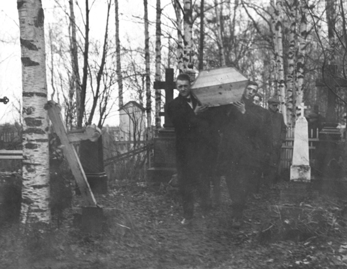 Pallbearers carrying the coffin of a soldier who died of influenza.
