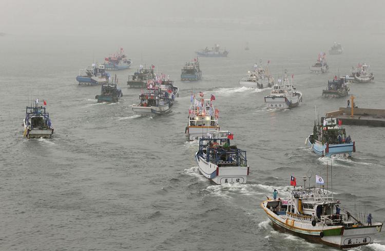 A fleet of fishing boats at sea.