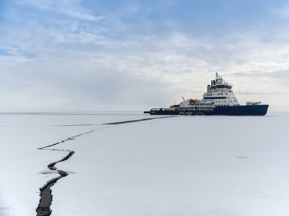 An icebreaker ship makes its way through Arctic sea ice An icebreaker ship makes its way through Arctic sea ice