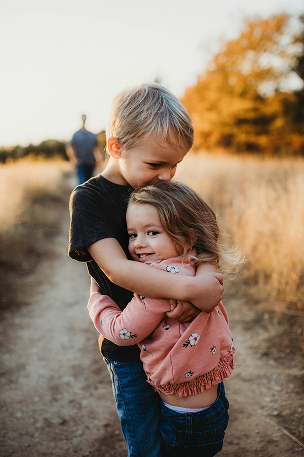 Hugs Photo of a brother and sister hugging each other.