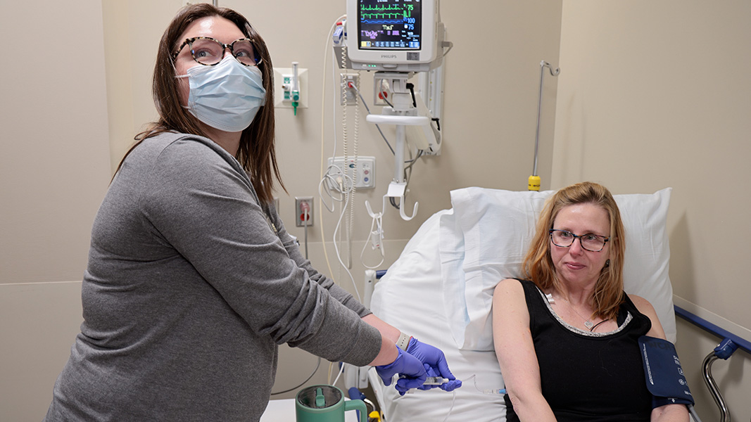 The Big Day A woman in a hospital bed is receiving an infusion