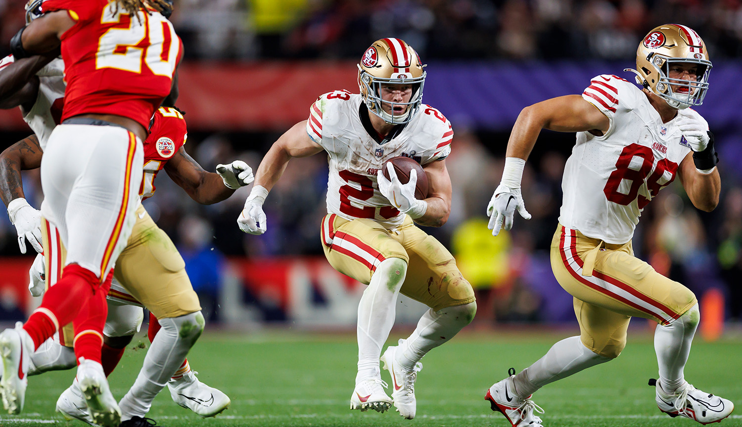 American football player Christian McCaffrey runs with the ball during the 2024 Super Bowl